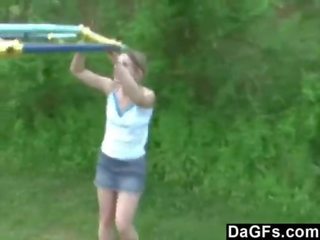 Young teen plays in the park and flashes her body